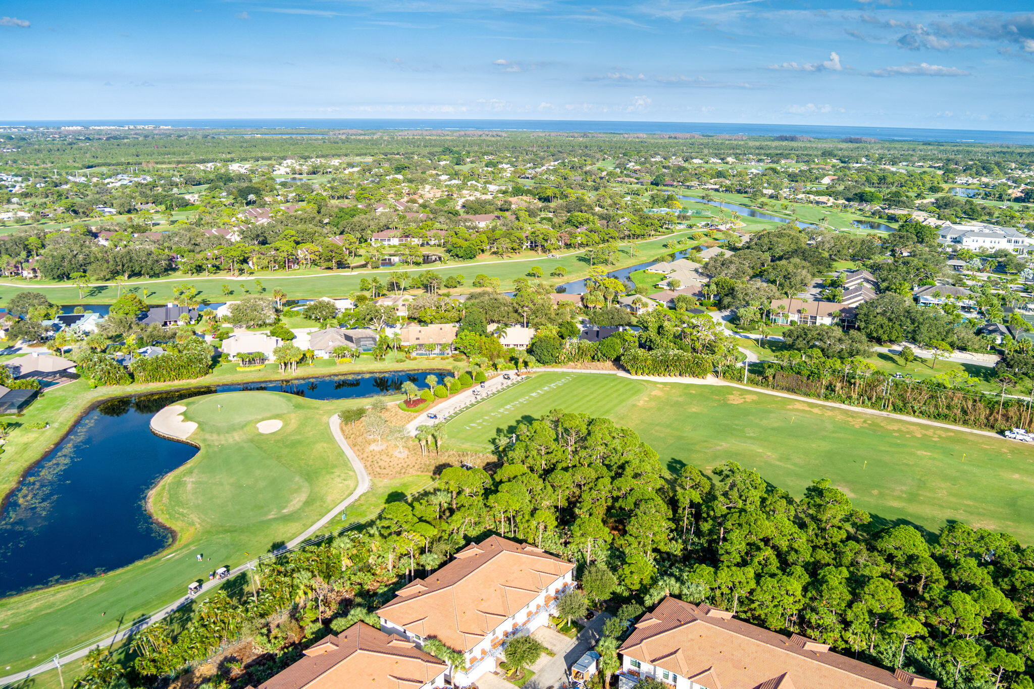 6675 Southeast Woodmill Pond Lane Stuart, FL 34997 - Photo 49 of 61 a view of a lake with a city view