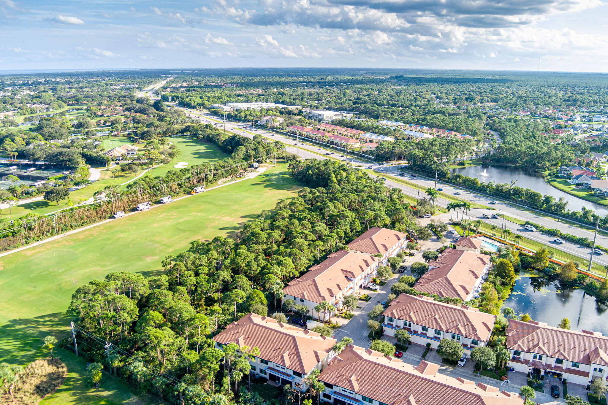 6675 Southeast Woodmill Pond Lane Stuart, FL 34997 - Photo 51 of 61 an aerial view of residential houses with outdoor space and river