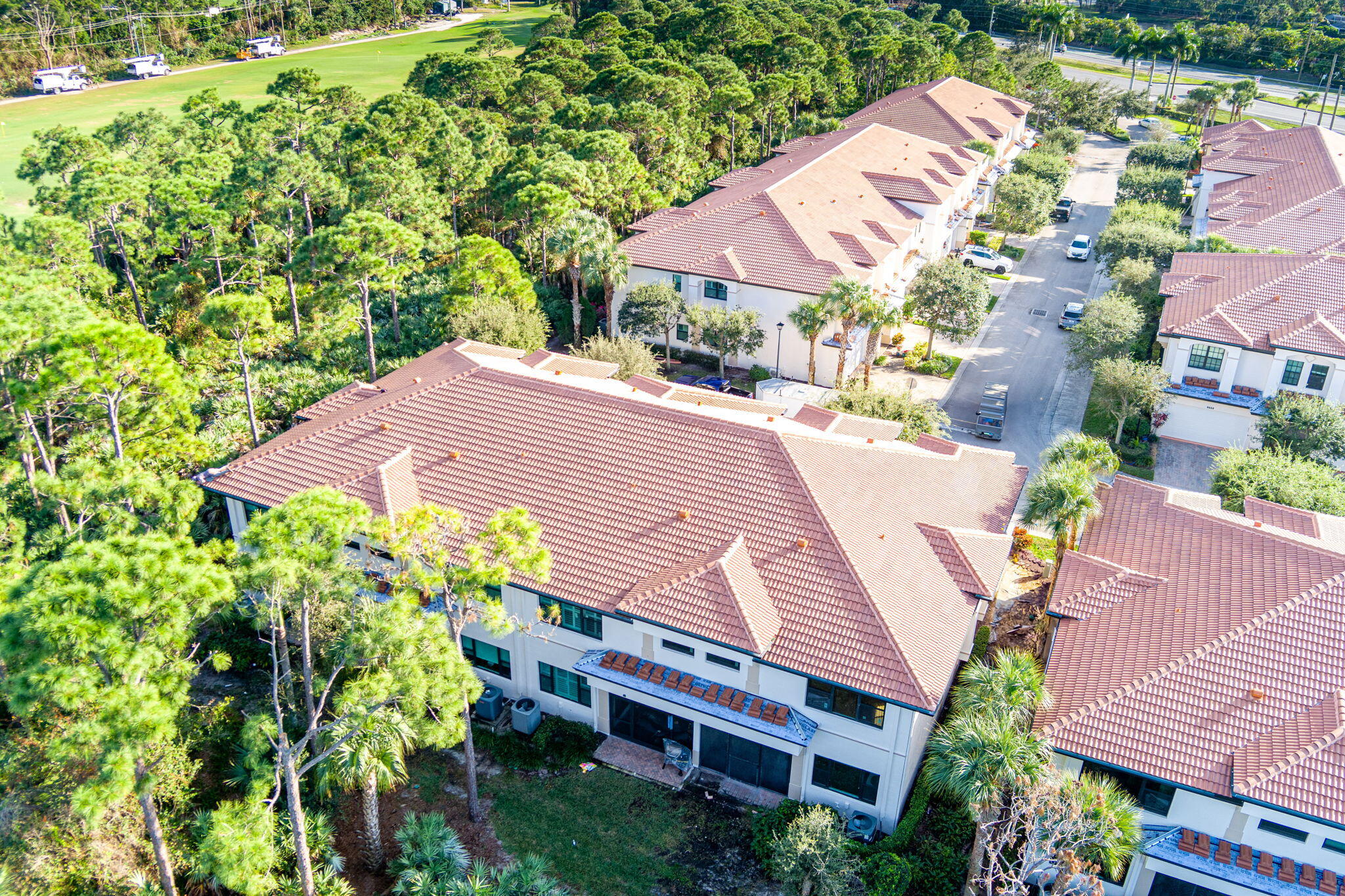 6675 Southeast Woodmill Pond Lane Stuart, FL 34997 - Photo 55 of 61 an aerial view of a house with garden space and a street view