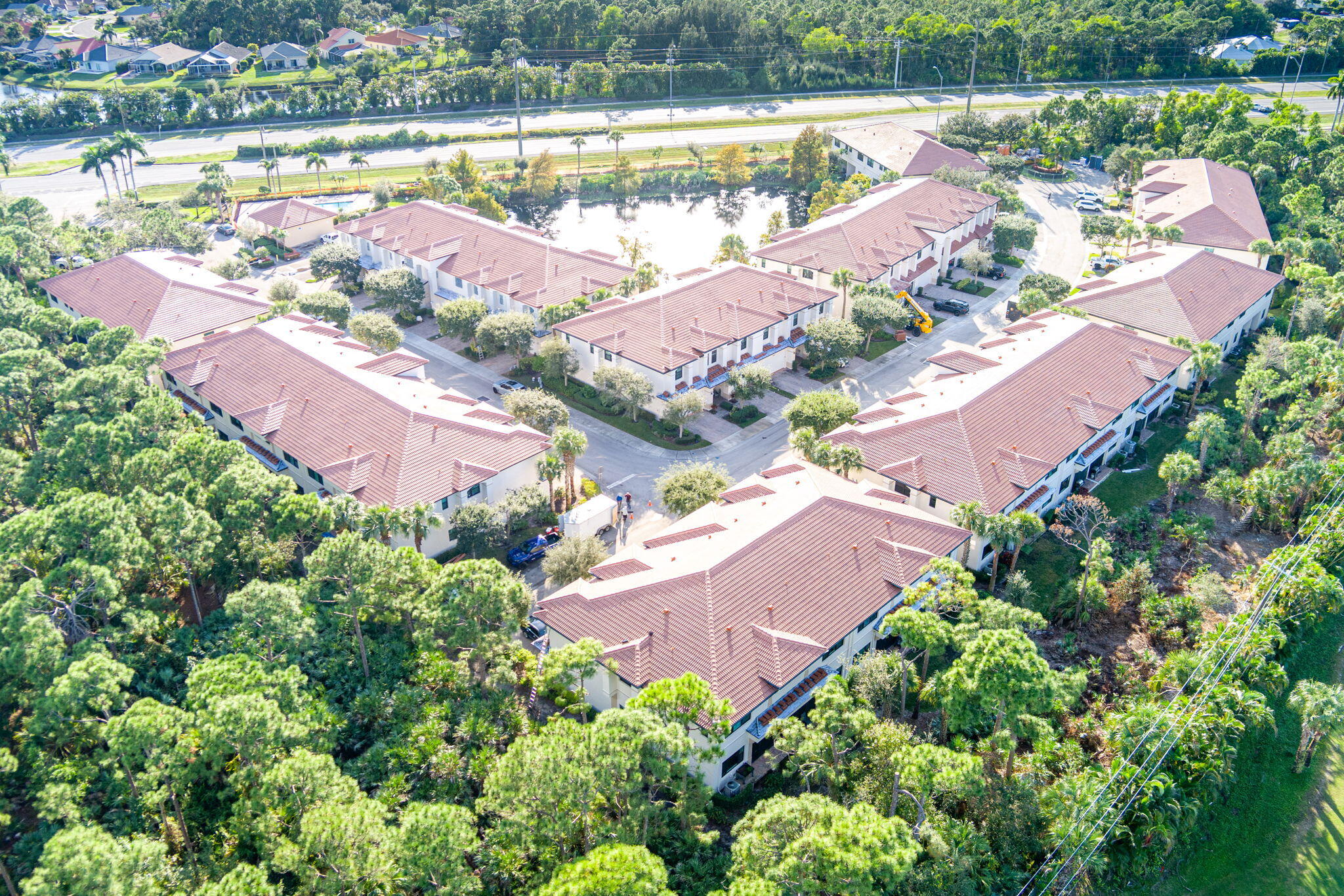 6675 Southeast Woodmill Pond Lane Stuart, FL 34997 - Photo 56 of 61 an aerial view of a house with a lake view