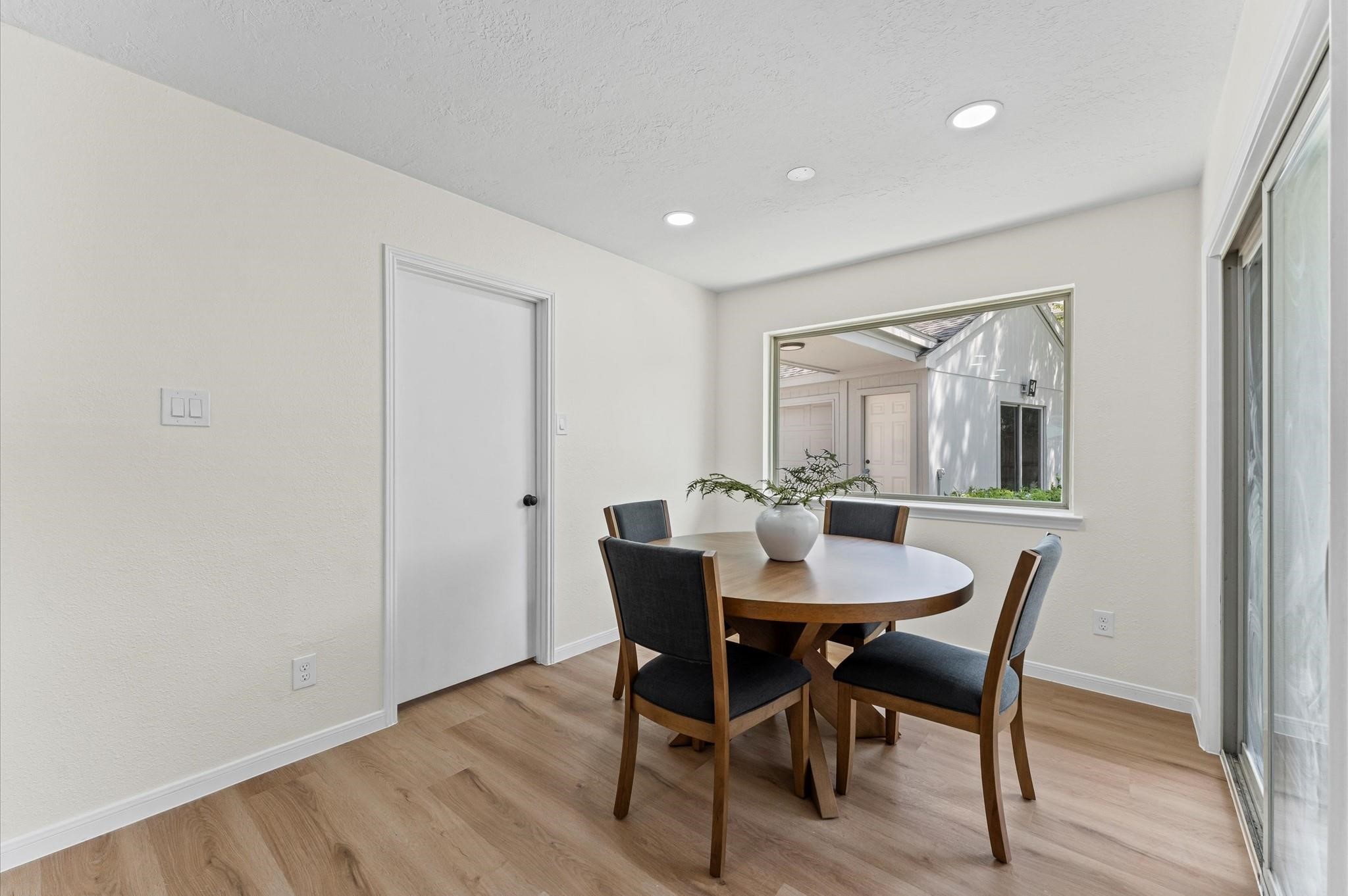 2914 Riata Lane Houston, TX 77043 - Photo 17 of 44 a view of a dining room with furniture and window