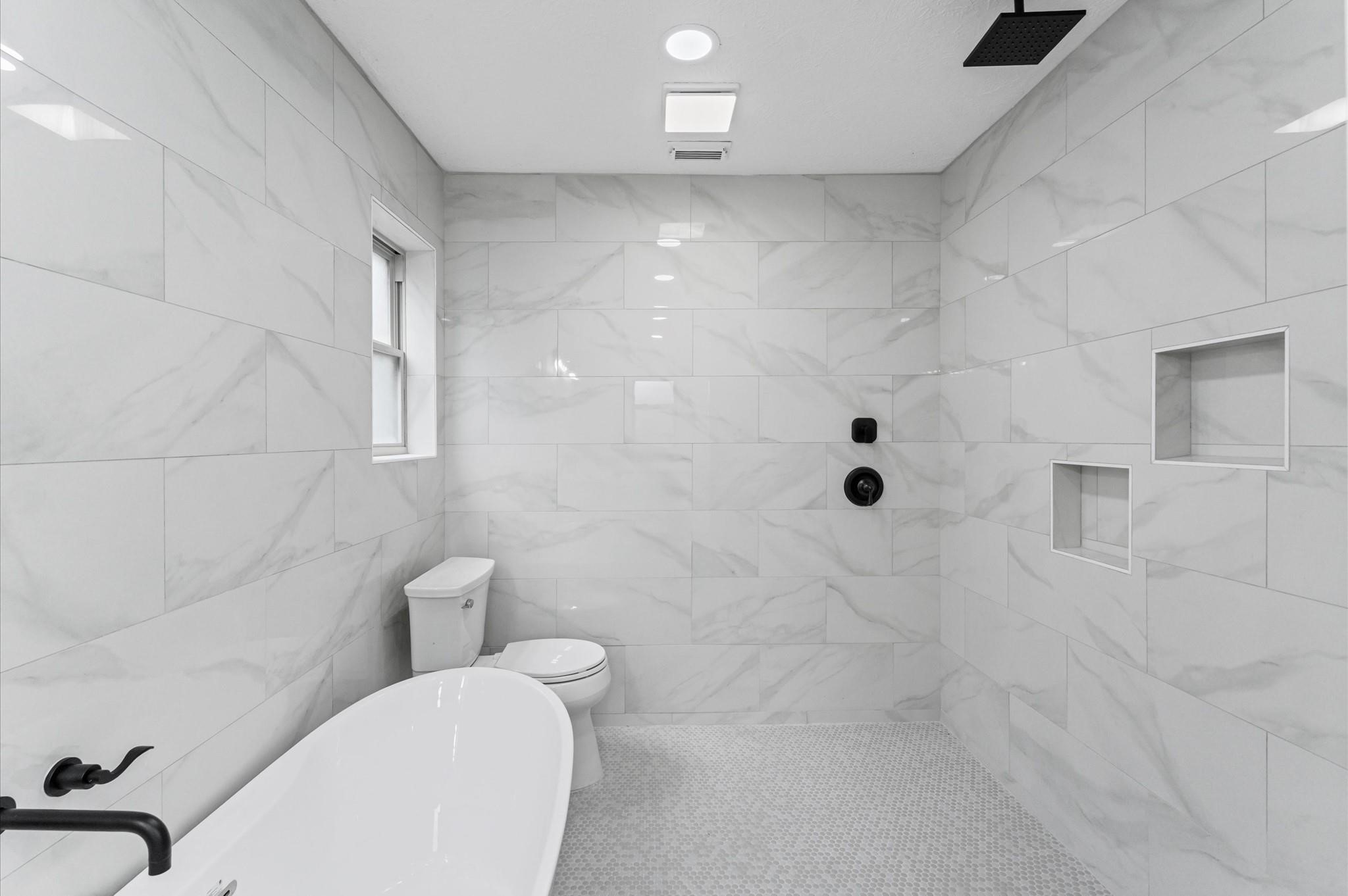 2914 Riata Lane Houston, TX 77043 - Photo 24 of 44 a bathroom with a toilet and shower