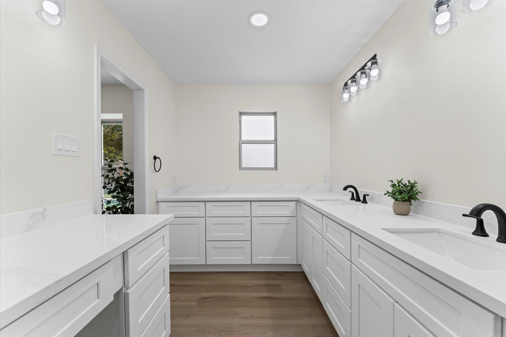 2914 Riata Lane Houston, TX 77043 - Photo 26 of 44 a bathroom with a sink and a bathtub