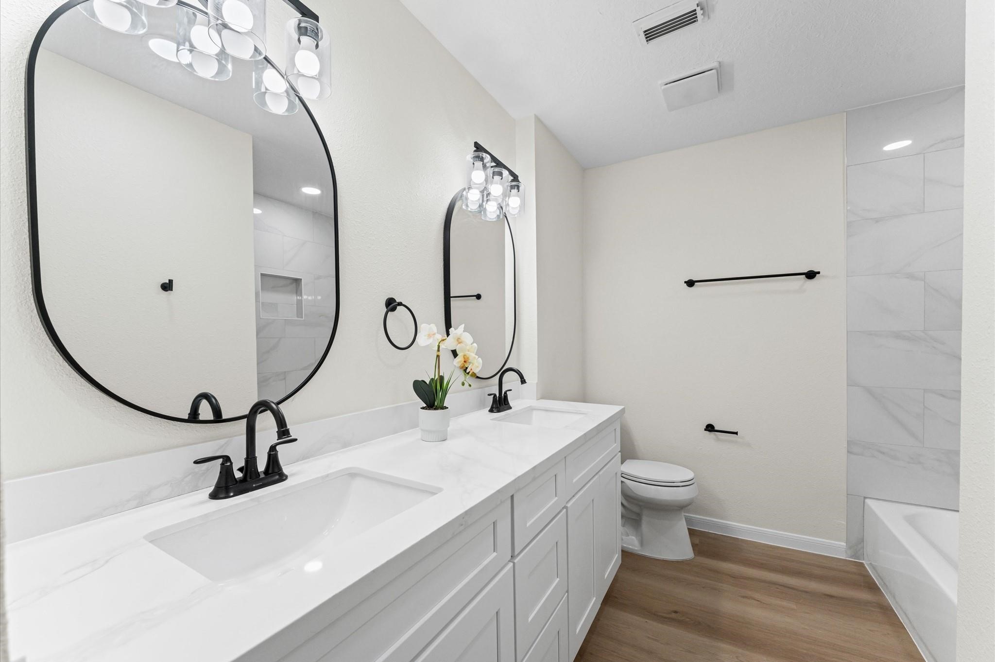 2914 Riata Lane Houston, TX 77043 - Photo 29 of 44 a bathroom with a sink and a mirror