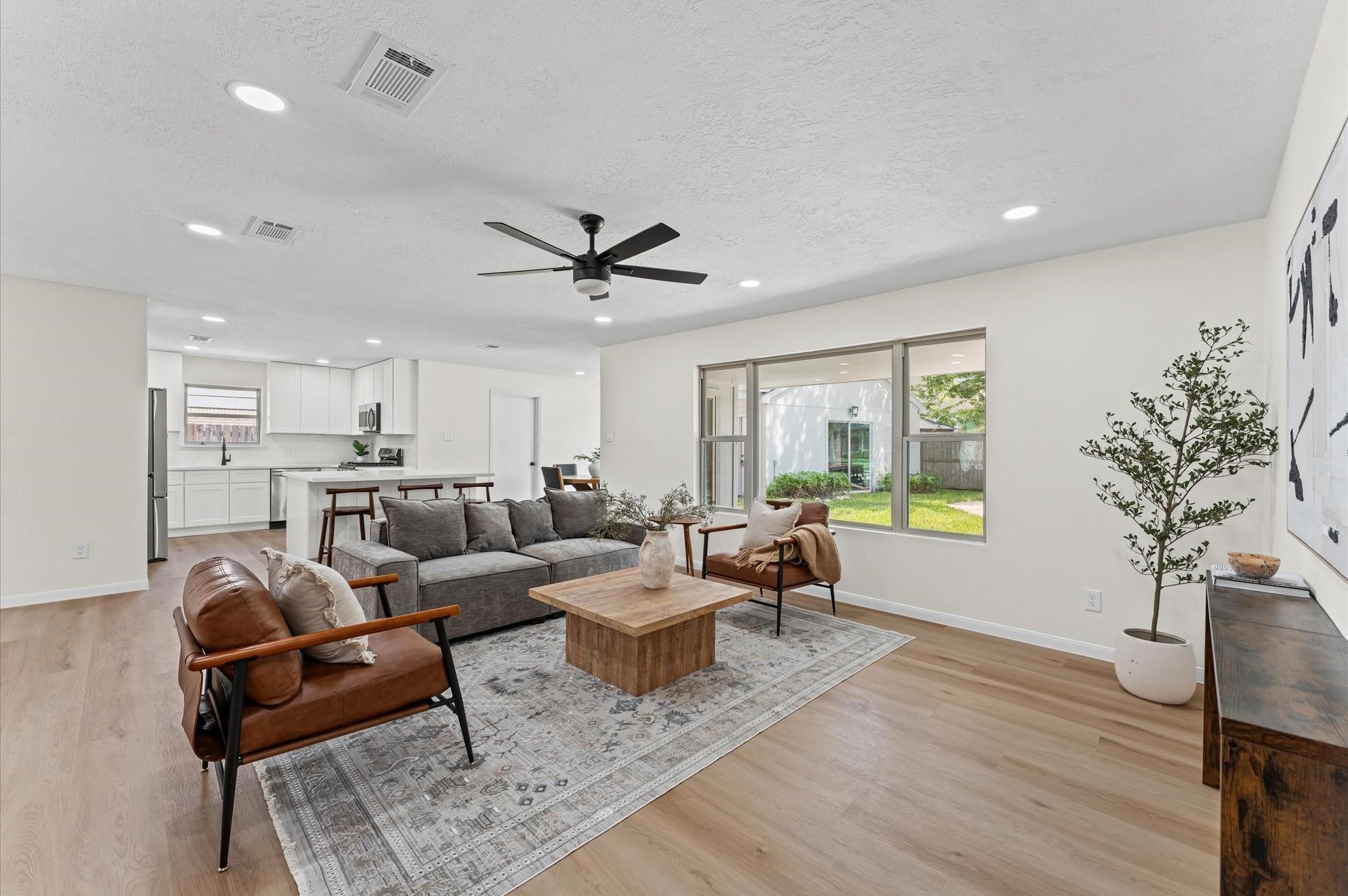 2914 Riata Lane Houston, TX 77043 - Photo 5 of 44 a living room with furniture and a large window