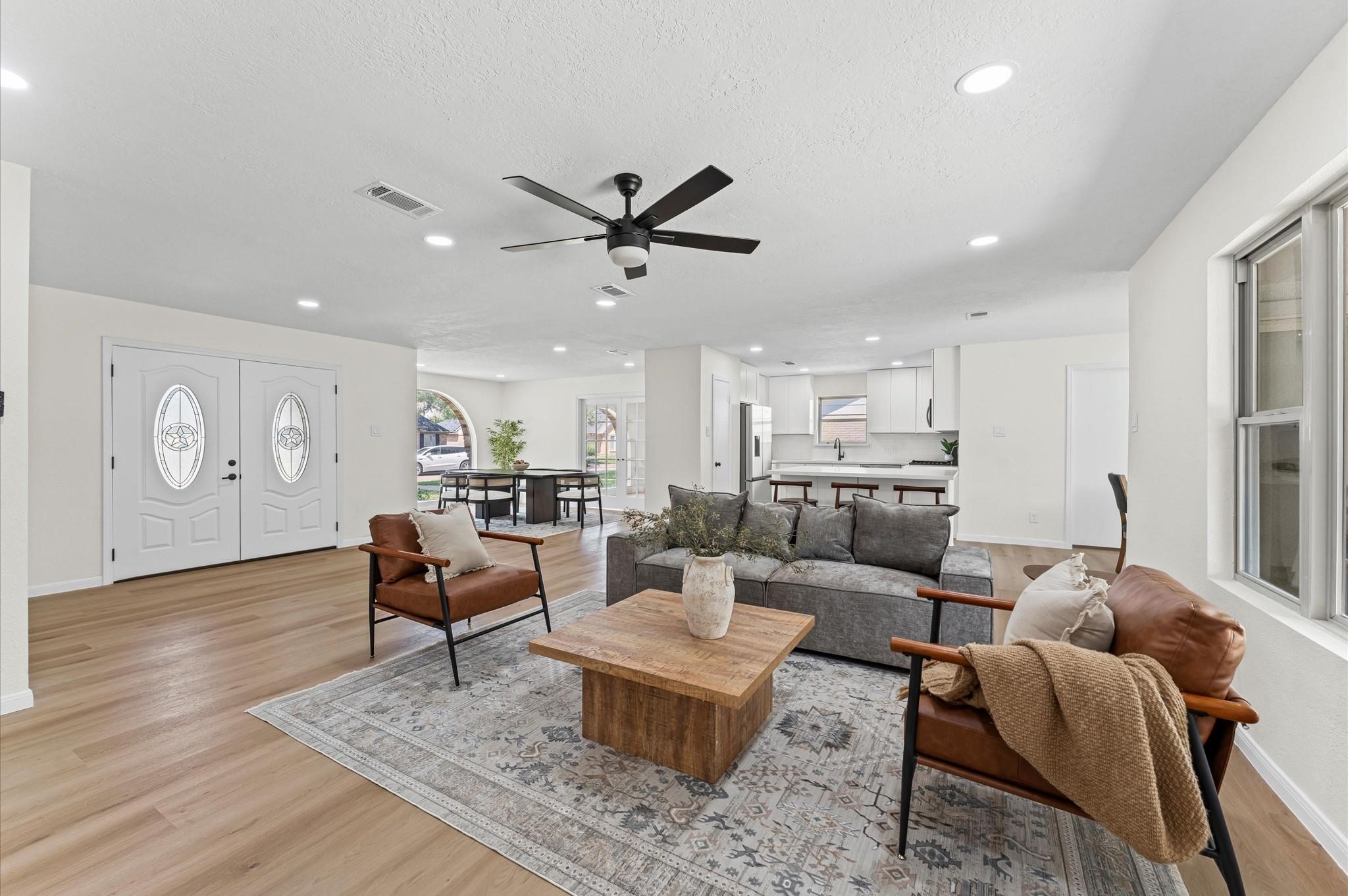 2914 Riata Lane Houston, TX 77043 - Photo 8 of 44 a living room with furniture and wooden floor