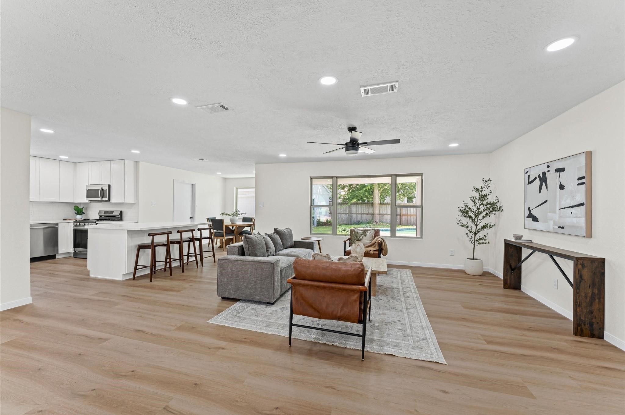 2914 Riata Lane Houston, TX 77043 - Photo 9 of 44 a living room with furniture and a large window