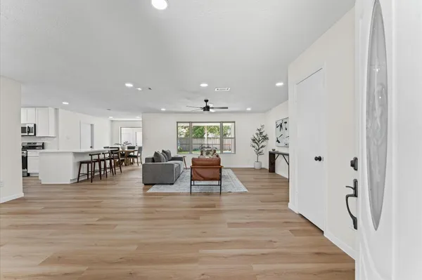 a lobby with furniture and wooden floor