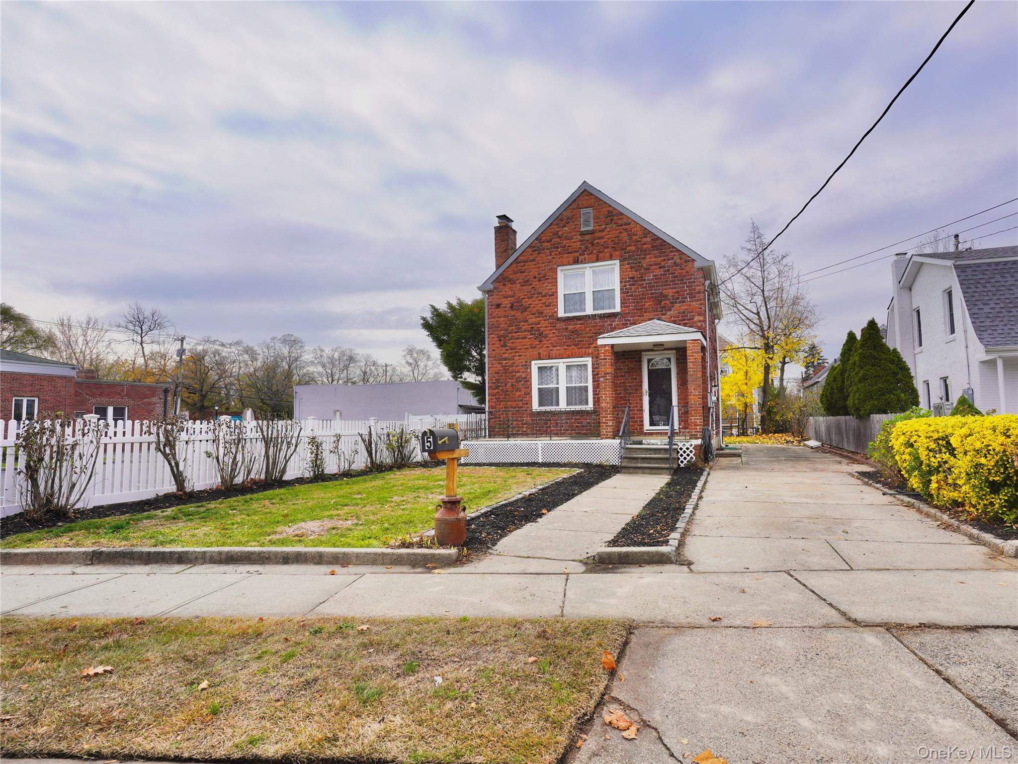 a view of a house with swimming pool and a yard