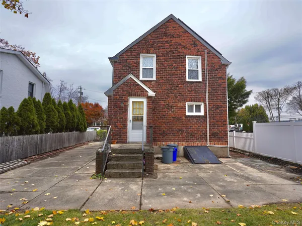 a front view of a house with garage