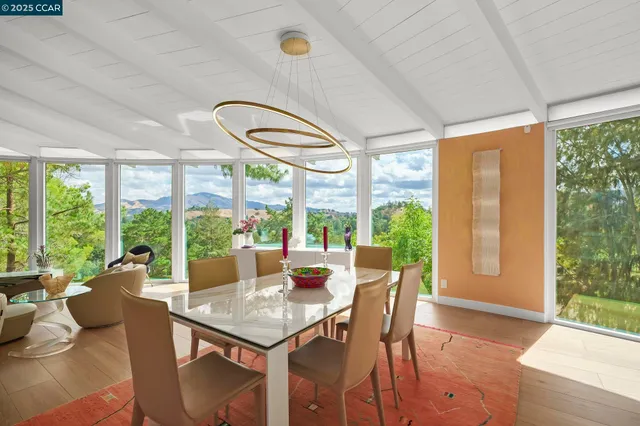 a terrace with outdoor seating and city view