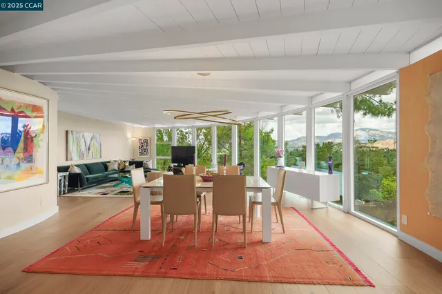 a sitting area with furniture and a garden view