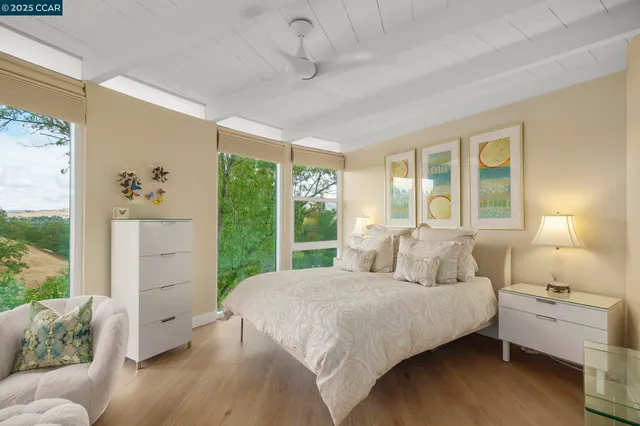 a bathroom with a glass shower door and a bathtub
