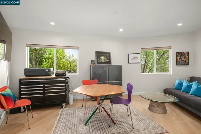 a view of a workspace with furniture and gym equipment