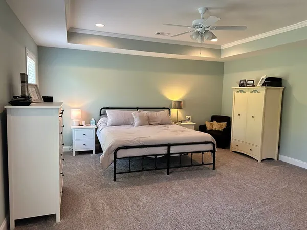 a room with a bed and a flat screen tv