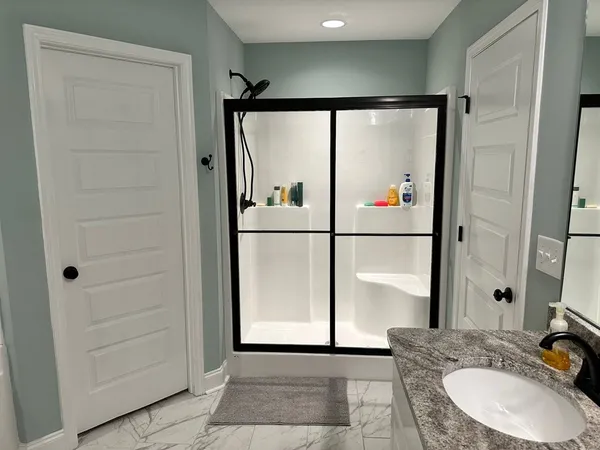 a bedroom with furniture and a window