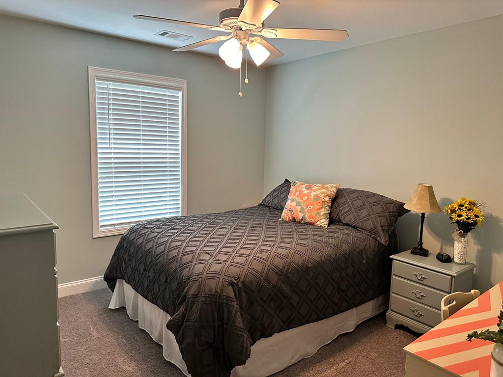 27 Veterans Court Fort Mitchell, AL 36856 - Photo 24 of 31 a bedroom with a bed and window