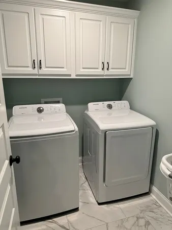 a living room filled with furniture and a table