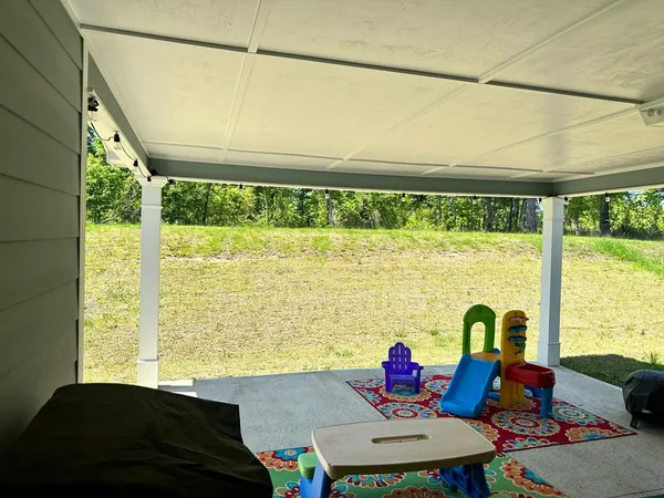 a backyard of a house with seating space