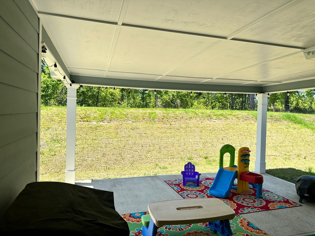 27 Veterans Court Fort Mitchell, AL 36856 - Photo 27 of 31 a living room with furniture and a large window
