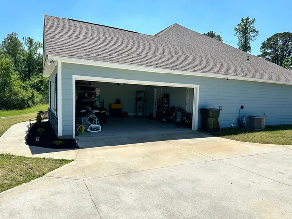 a front view of a house with a chairs and table
