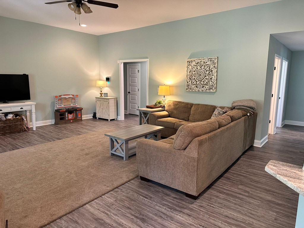 27 Veterans Court Fort Mitchell, AL 36856 - Photo 9 of 31 a living room with furniture and a flat screen tv