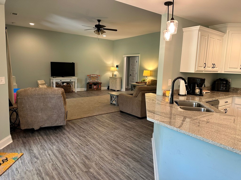 27 Veterans Court Fort Mitchell, AL 36856 - Photo 10 of 31 a living room with furniture and a flat screen tv