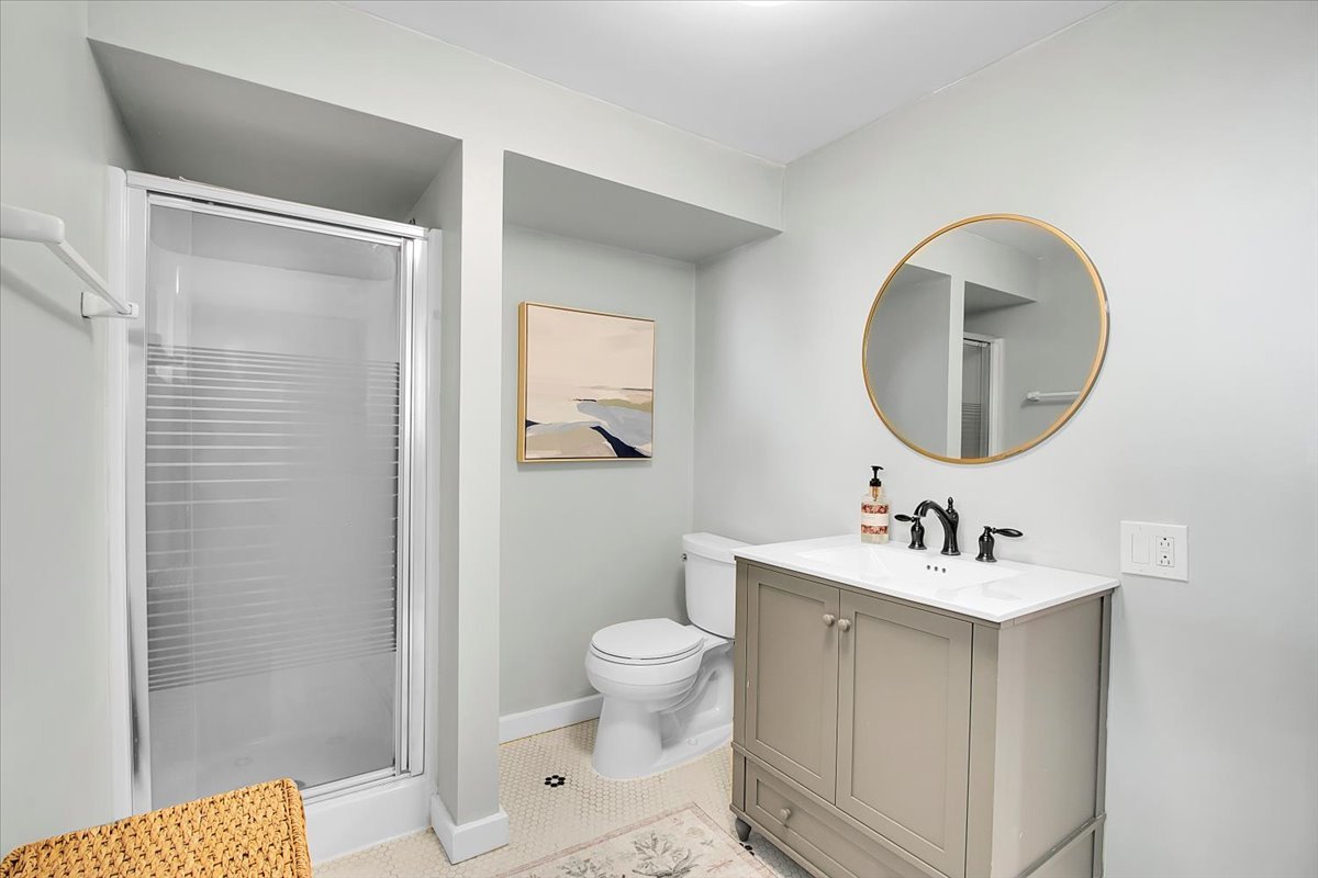 143 Walnut Street Frankfort, IL 60423 - Photo 22 of 38 a bathroom with a toilet sink and mirror