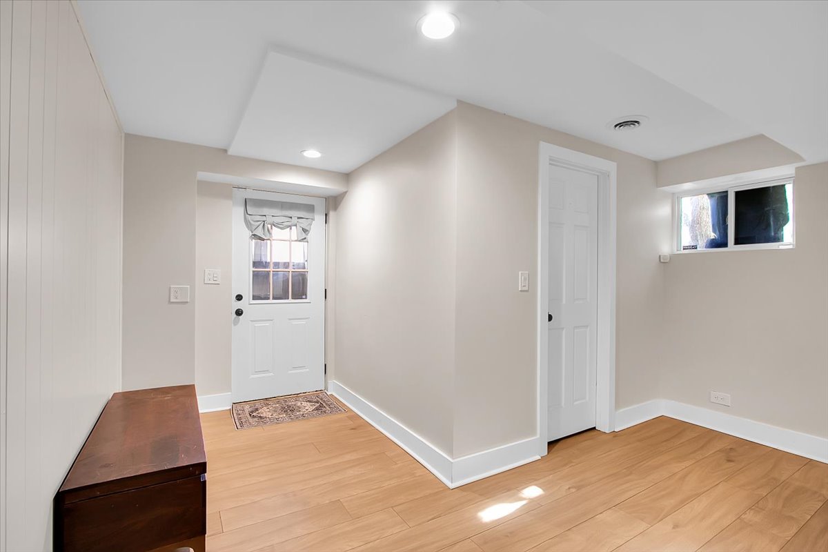143 Walnut Street Frankfort, IL 60423 - Photo 25 of 38 a view of a livingroom with wooden floor and cabinet