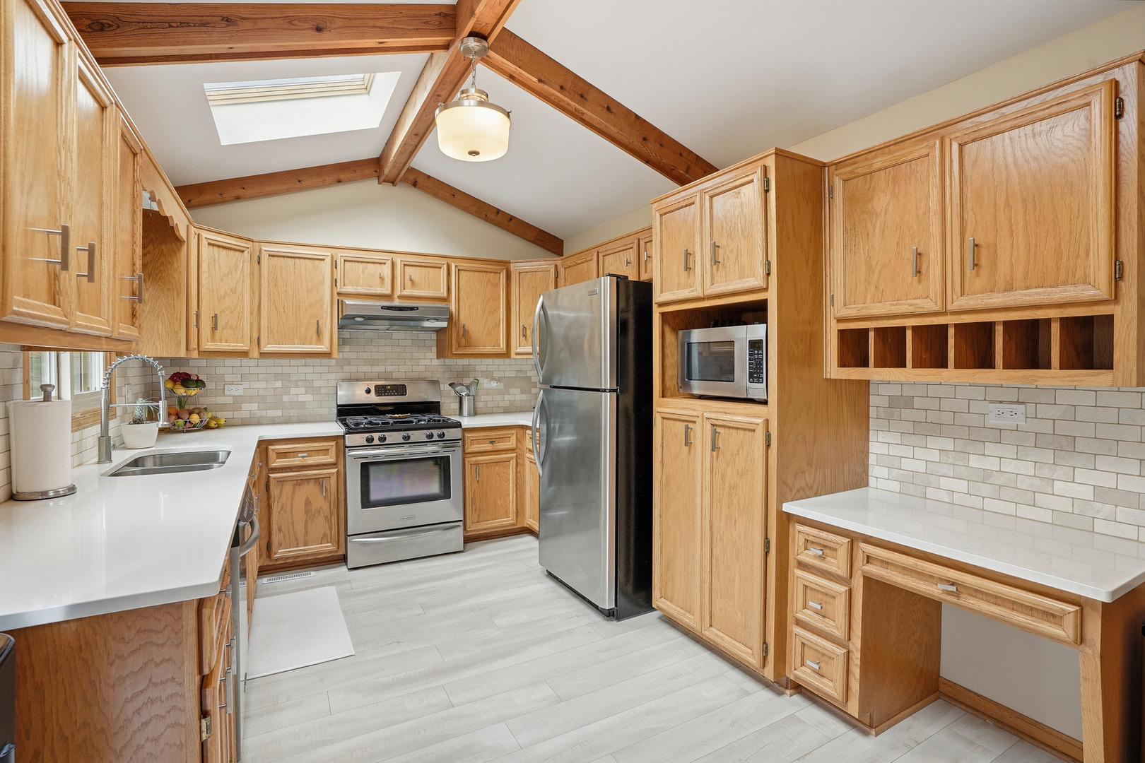 10 Zurich Court Crete, IL 60417 - Photo 15 of 37 a kitchen with stainless steel appliances granite countertop a refrigerator a stove and a sink with cabinets