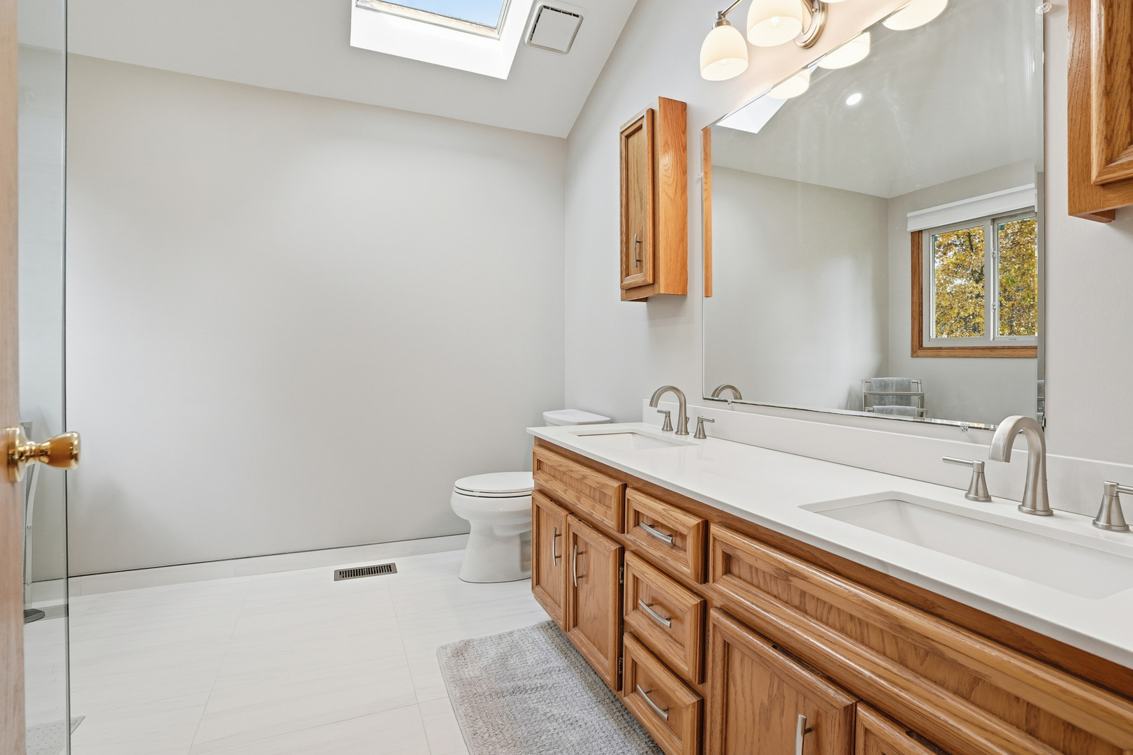 10 Zurich Court Crete, IL 60417 - Photo 26 of 37 a spacious bathroom with a double vanity sink a toilet and a mirror