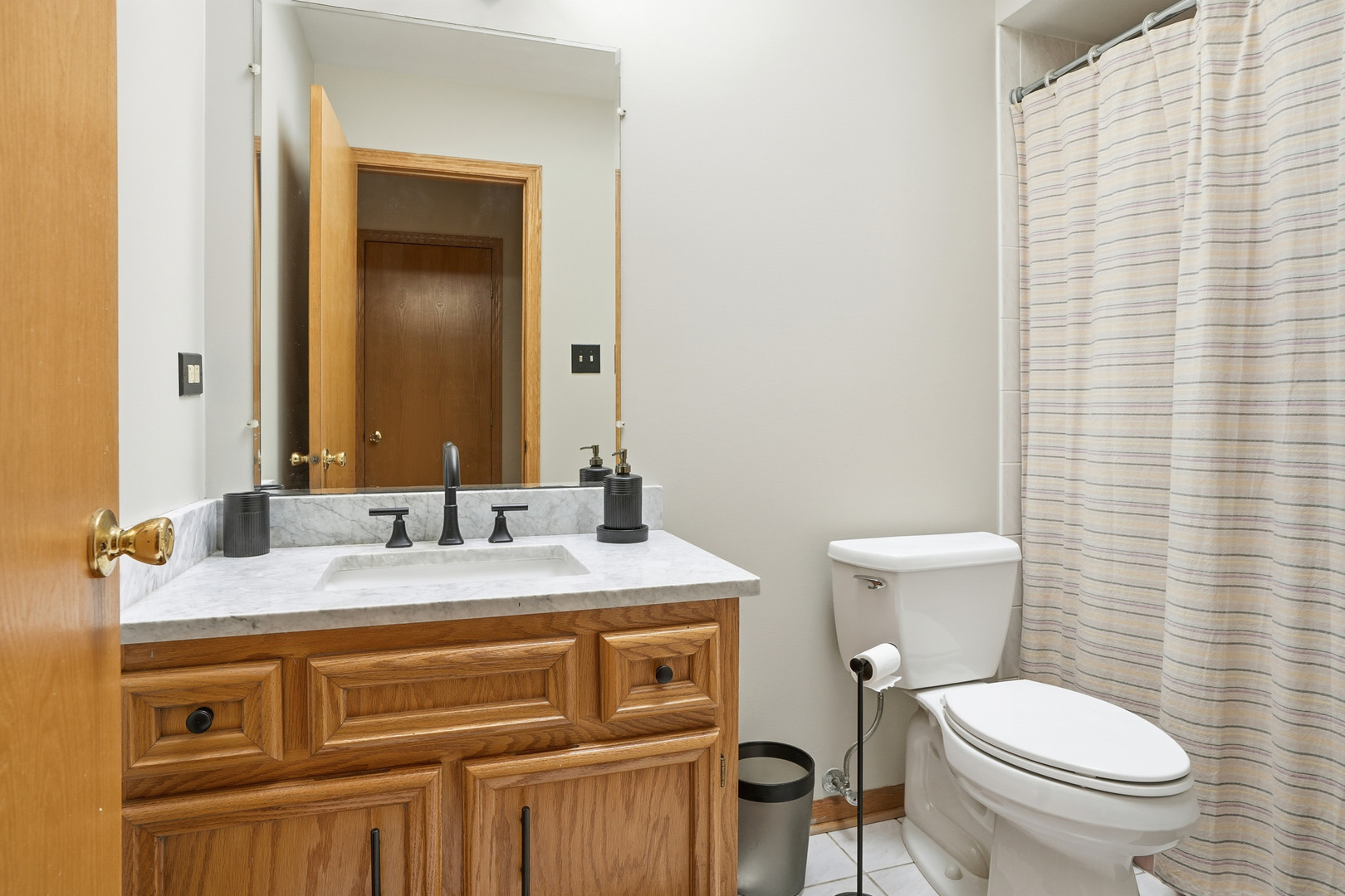10 Zurich Court Crete, IL 60417 - Photo 32 of 37 a bathroom with a granite countertop toilet sink and mirror