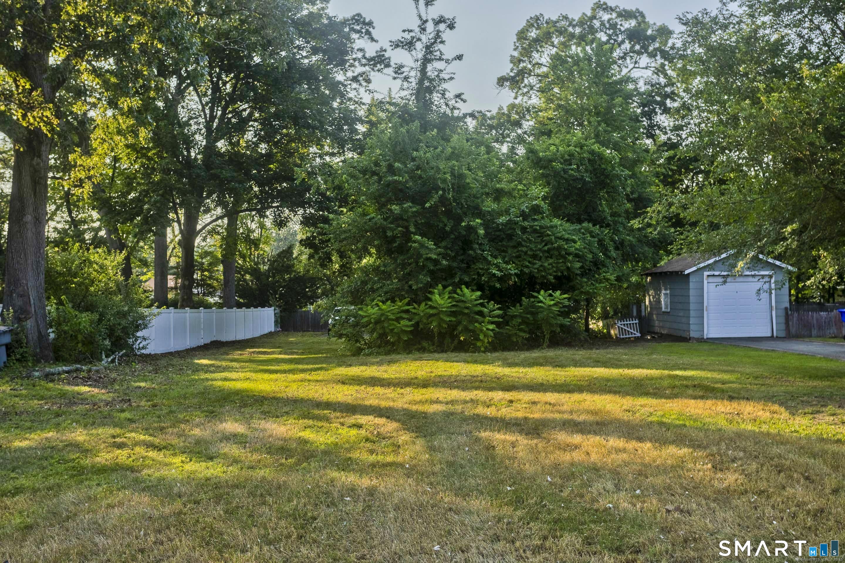 10 1/2 South Road Enfield, CT 06082 - Photo 2 of 20 a view of a swimming pool with an outdoor space and seating area
