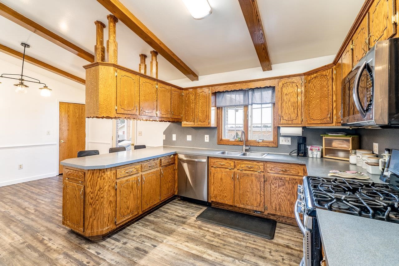 8213 Robinson Road Dayton, VA 22821 - Photo 15 of 75 a kitchen with stainless steel appliances granite countertop a sink a stove and a wooden floors