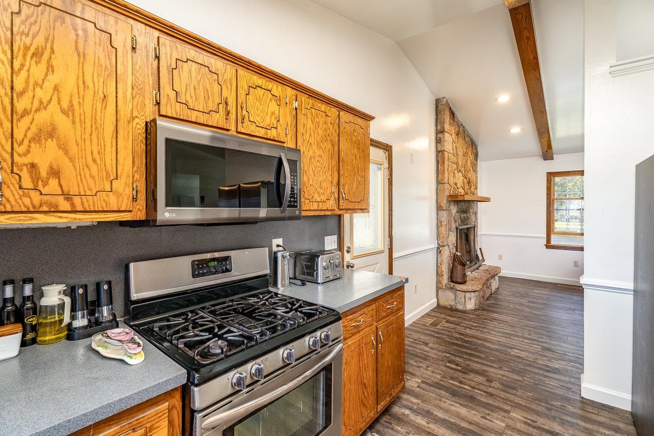 8213 Robinson Road Dayton, VA 22821 - Photo 18 of 75 a kitchen with stainless steel appliances a stove and a wooden floor