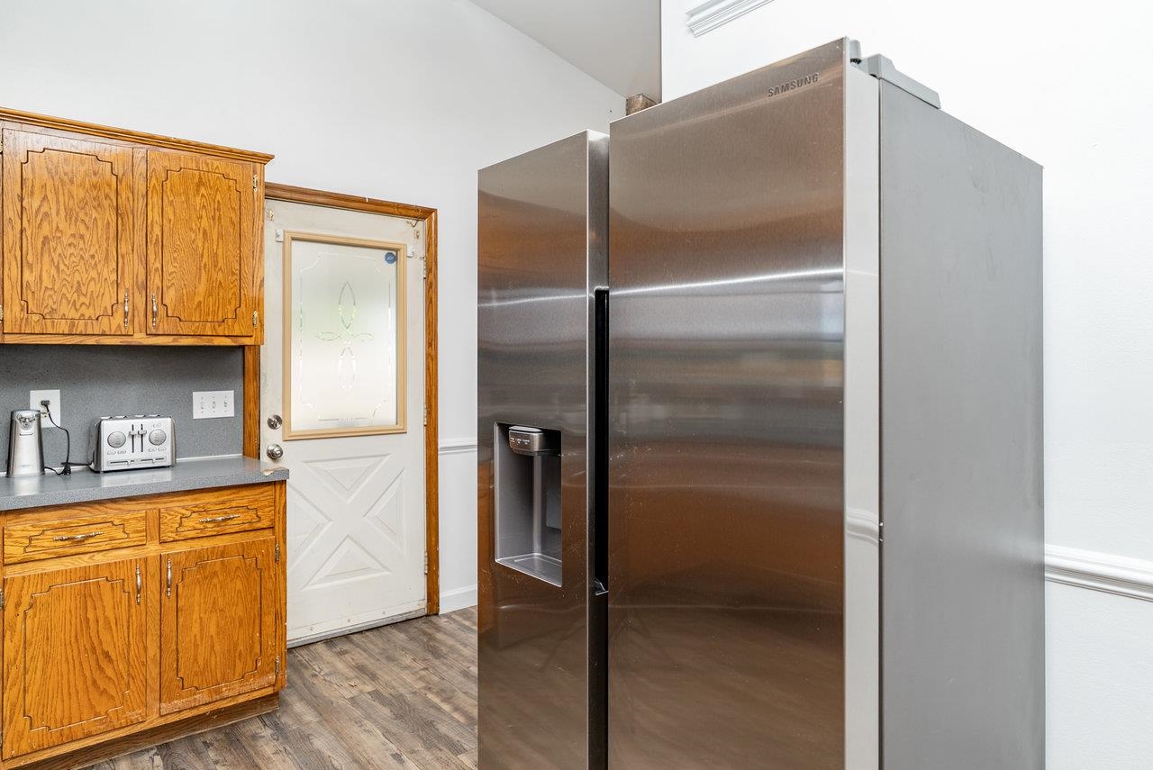 8213 Robinson Road Dayton, VA 22821 - Photo 20 of 75 a kitchen with granite countertop a refrigerator and a sink