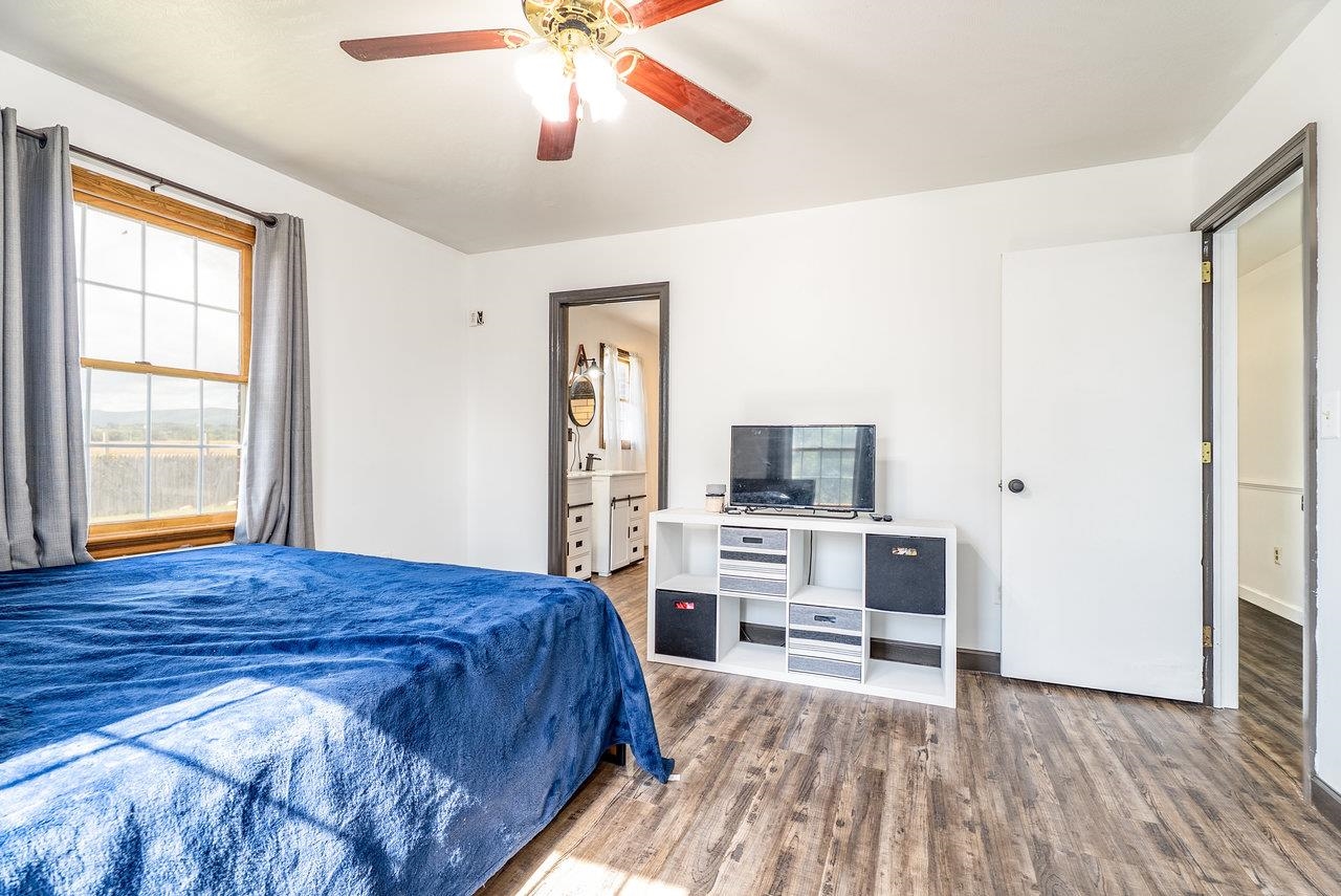 8213 Robinson Road Dayton, VA 22821 - Photo 30 of 75 a bedroom with a bed and a flat screen tv