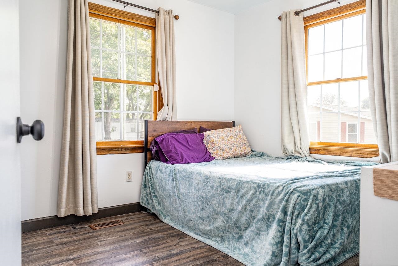 8213 Robinson Road Dayton, VA 22821 - Photo 35 of 75 a bedroom with a bed and wooden floor
