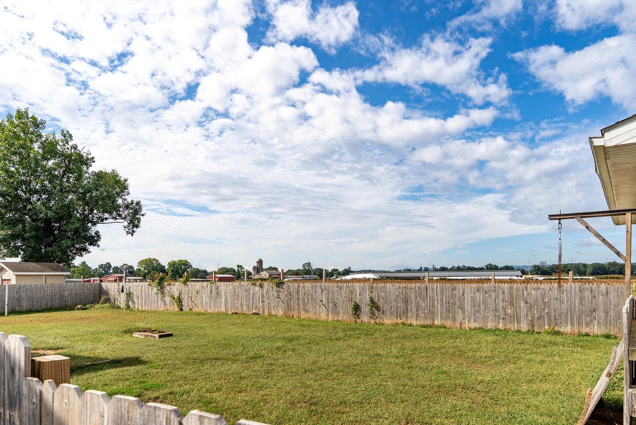 8213 Robinson Road Dayton, VA 22821 - Photo 64 of 75 a view of a lake with houses in the back