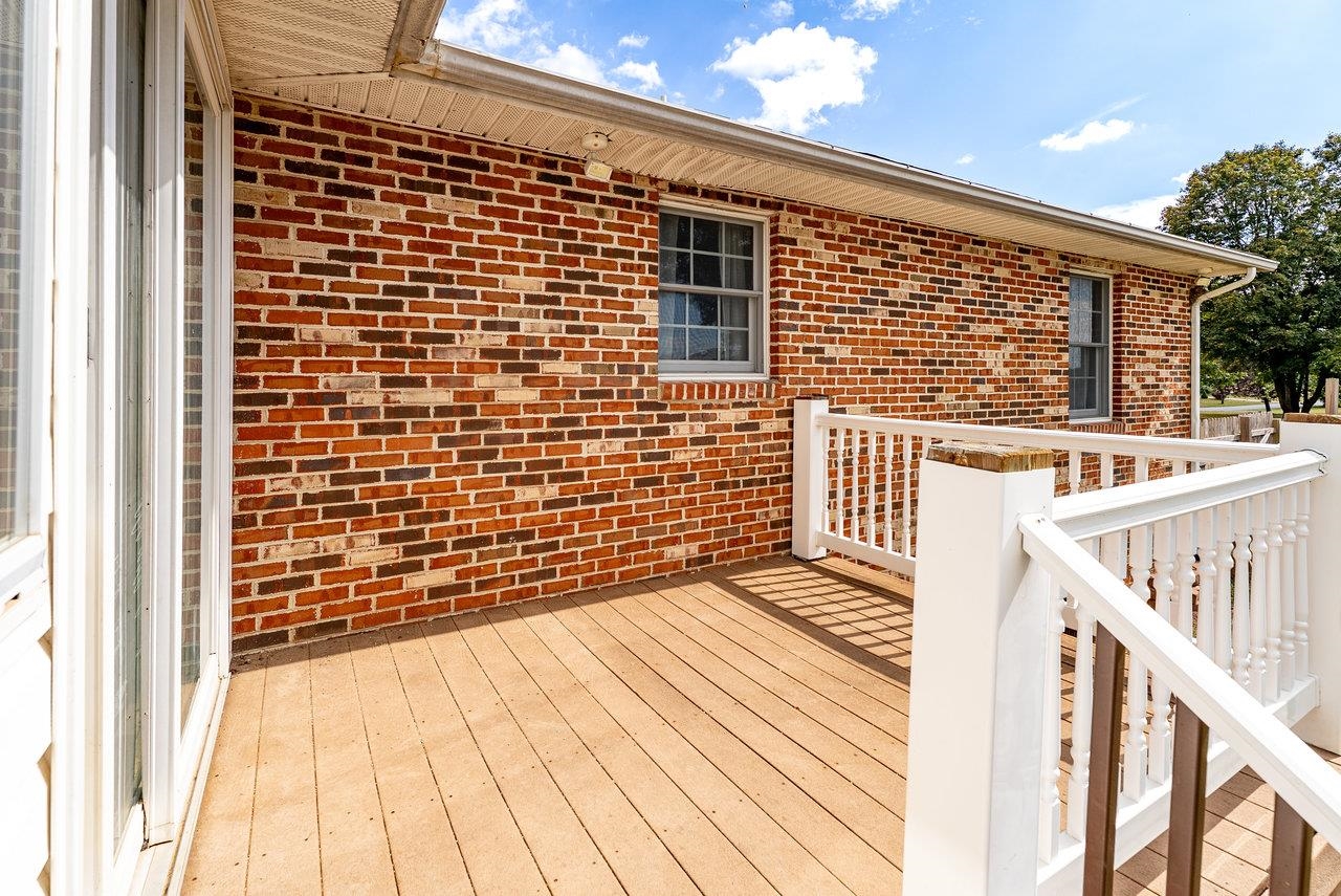 8213 Robinson Road Dayton, VA 22821 - Photo 71 of 75 a view of a balcony with wooden floor and iron stairs