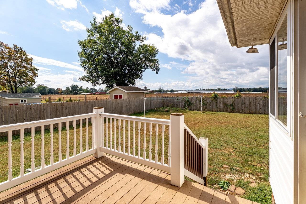 8213 Robinson Road Dayton, VA 22821 - Photo 72 of 75 a view of balcony with wooden floor and fence