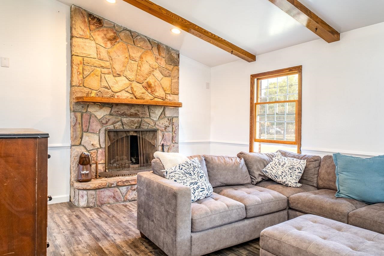 8213 Robinson Road Dayton, VA 22821 - Photo 8 of 75 a living room with furniture a fireplace and a large window