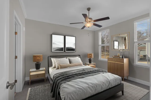 a bedroom with a bed and a chandelier