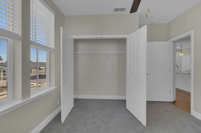 a bathroom with a shower toilet and sink
