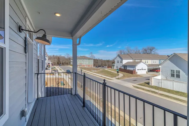 a view of a balcony with wooden floor