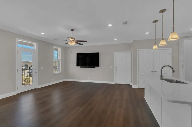 a view of a kitchen with a sink and a microwave