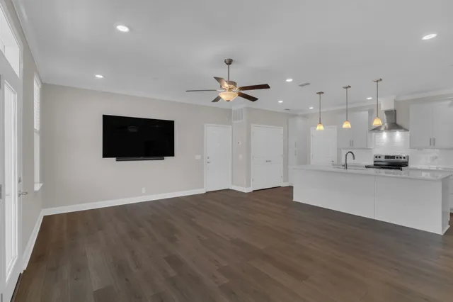 a view of kitchen with sink and microwave