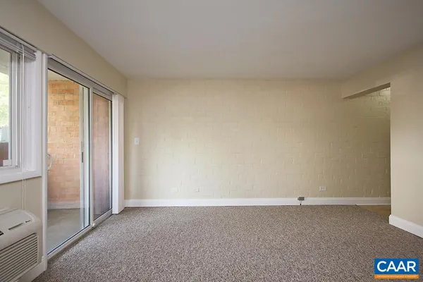 a view of an empty room and window