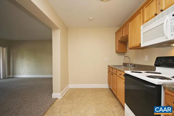 a kitchen with stainless steel appliances granite countertop a stove and a sink