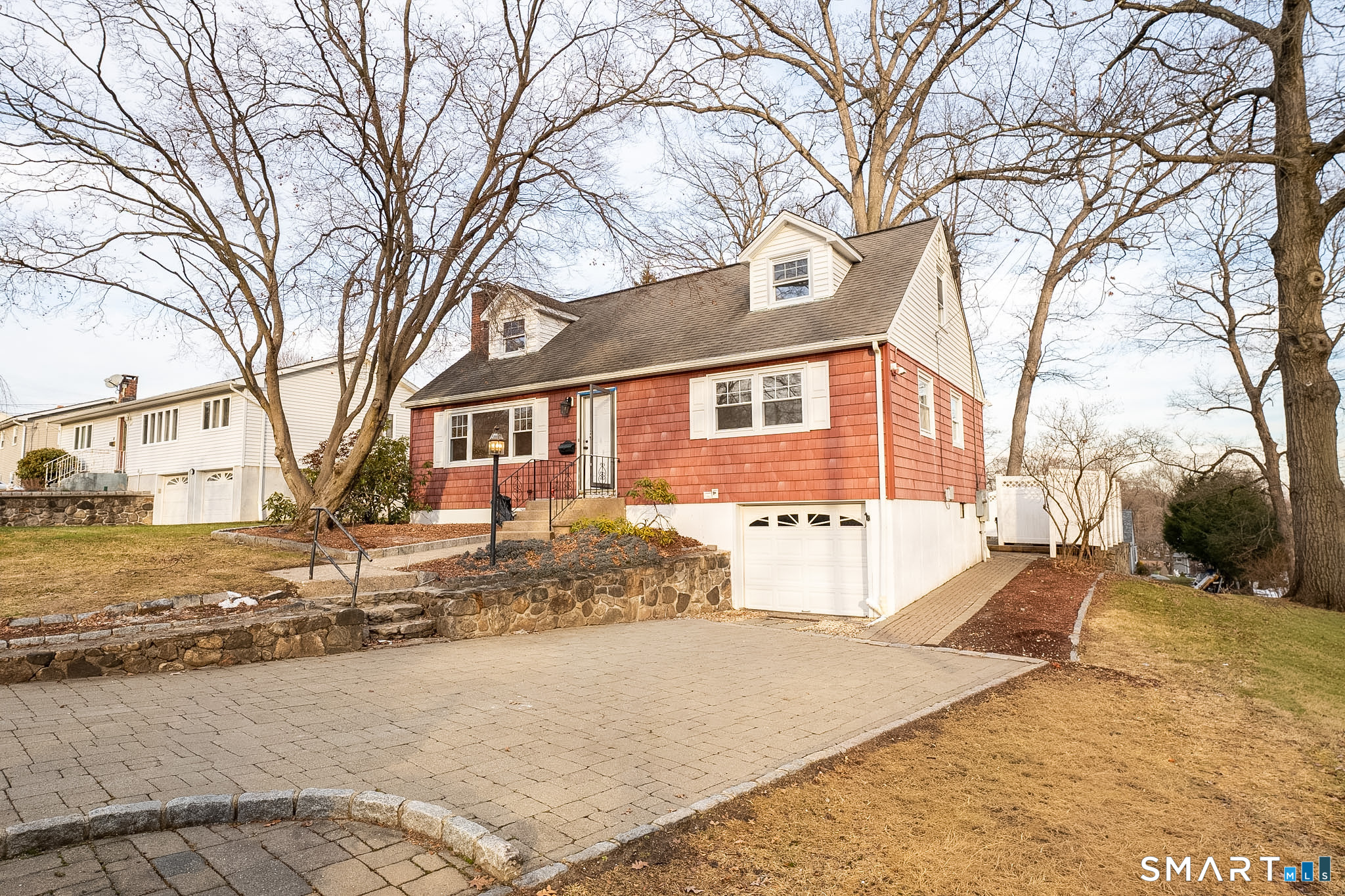 a view of a house with snow on the road